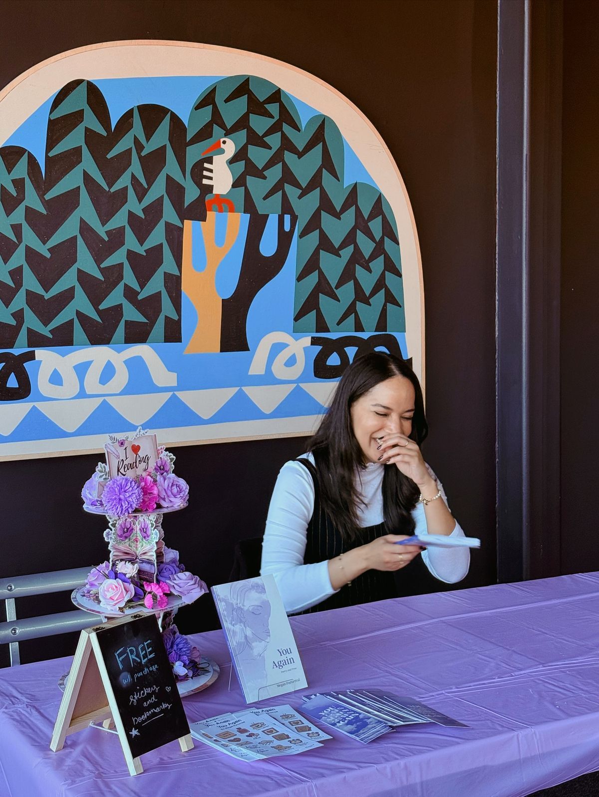 Author at signing table with fans