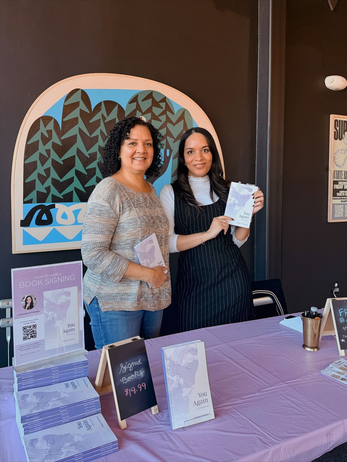 Author with reader at book signing